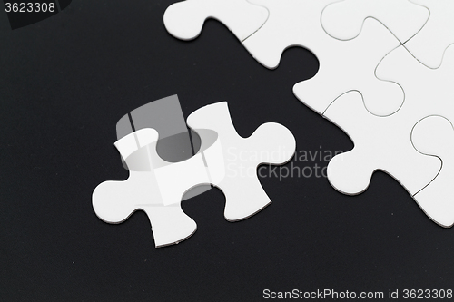 Image of Plain puzzle over black background