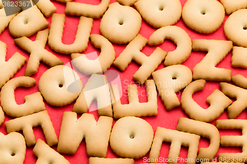 Image of Assorted word biscuit over red background