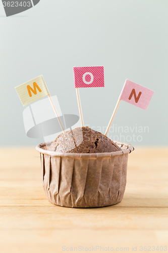Image of Chocolate muffins with small flag of a word mon