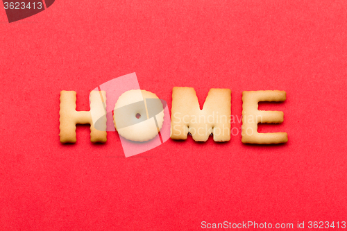 Image of Word home biscuit over the red background