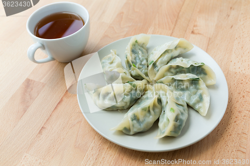 Image of Chinese dumpling with a cup of tea