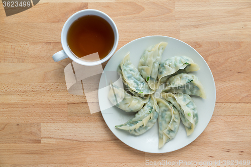 Image of Meat dumpling with a cup of tea