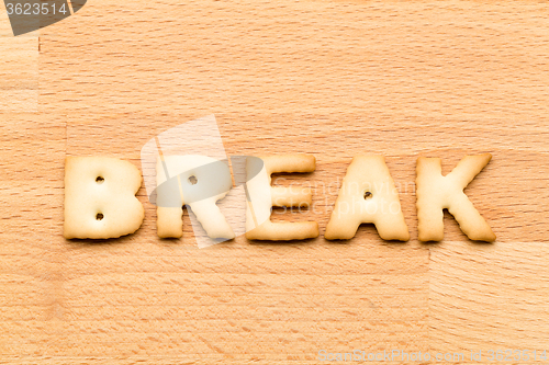 Image of Word break cookie over the wooden background