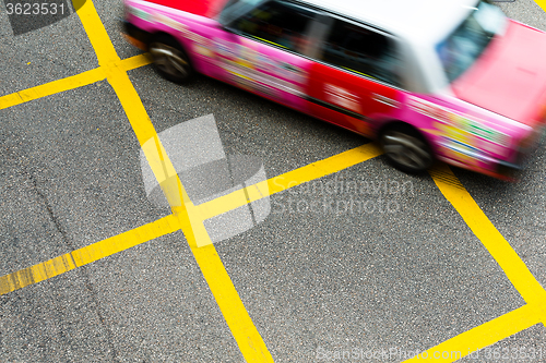 Image of Blurred picture of Taxi speeding up in Hong Kong