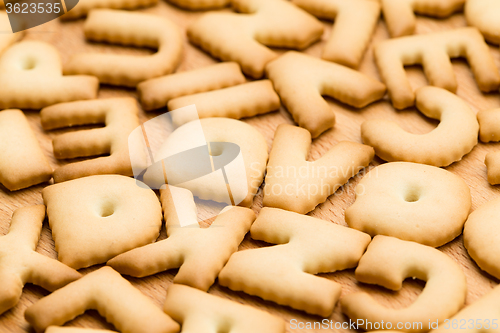 Image of Letter Cookie over the wooden table