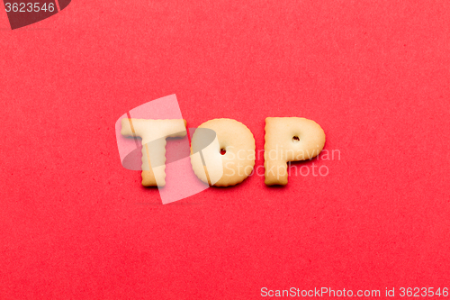 Image of Word top cookies over the red background