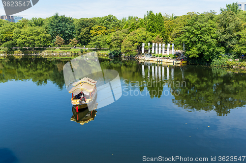 Image of Tourism boat on river in park