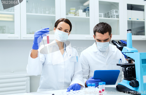 Image of young scientists making test or research in lab