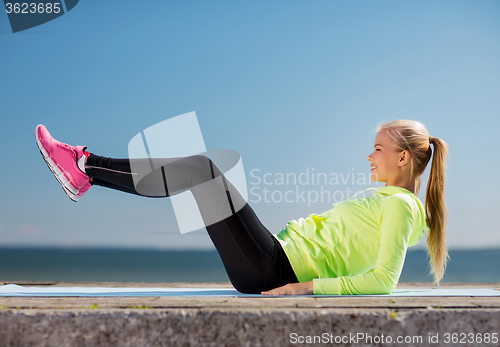 Image of woman doing sports outdoors