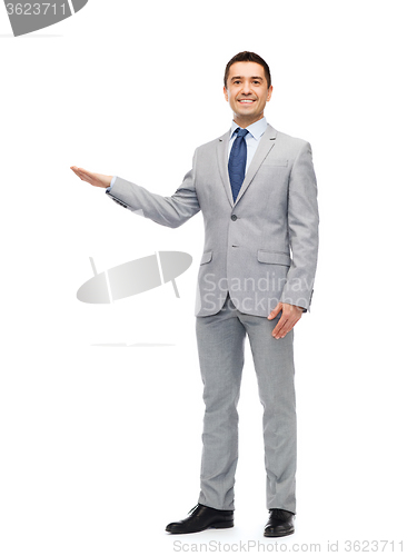 Image of happy smiling businessman in suit