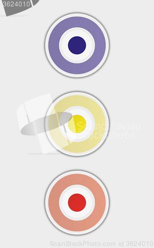 Image of three color badges or buttons