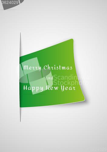 Image of merry christmas card inserted into paper