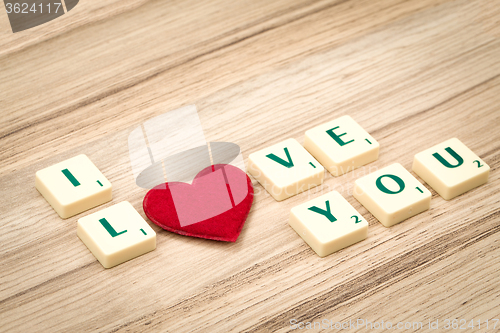 Image of valentine\'s hearts on a wooden background