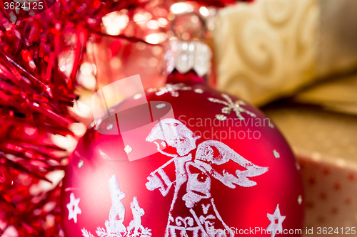 Image of christmas decoration and golden box with ribbon