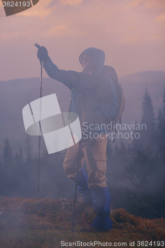 Image of advanture man with backpack hiking