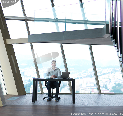 Image of young business man at office