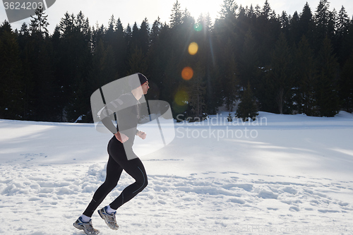 Image of jogging on snow in forest