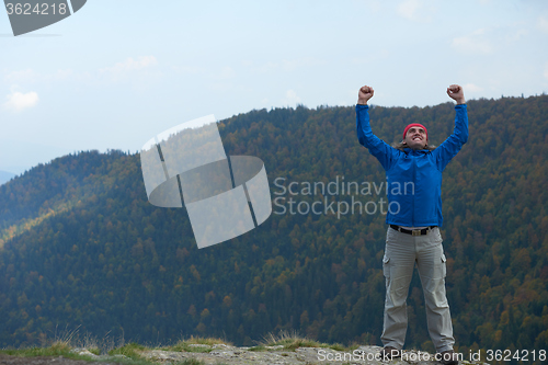 Image of advanture man with backpack hiking