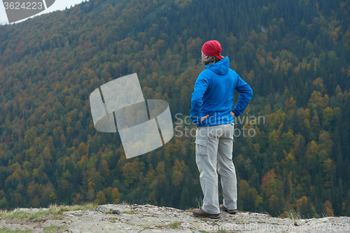 Image of advanture man with backpack hiking