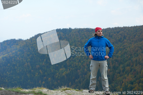 Image of advanture man with backpack hiking