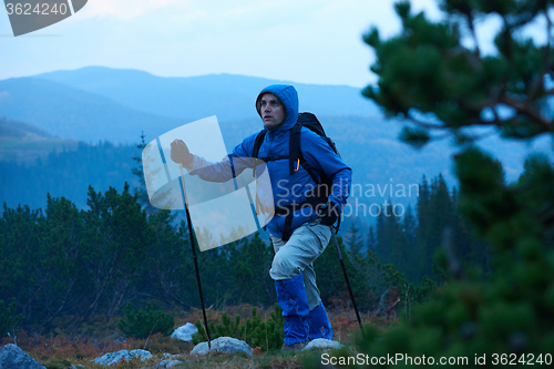 Image of advanture man with backpack hiking