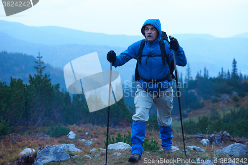 Image of advanture man with backpack hiking