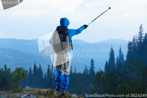 Image of advanture man with backpack hiking