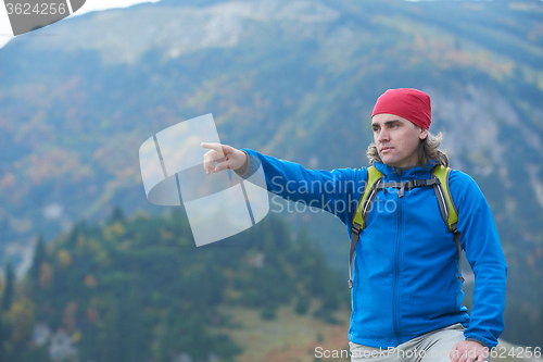 Image of advanture man with backpack hiking