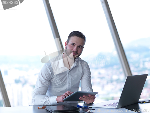 Image of young business man at office