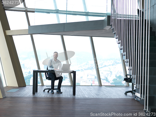 Image of young business man at office