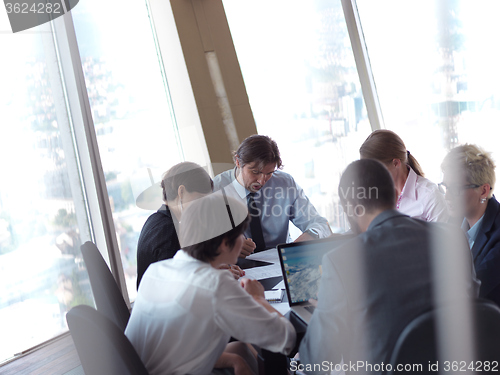 Image of business people group on meeting at bright modern office