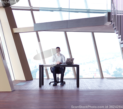 Image of young business man at office