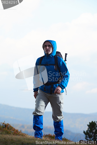 Image of advanture man with backpack hiking