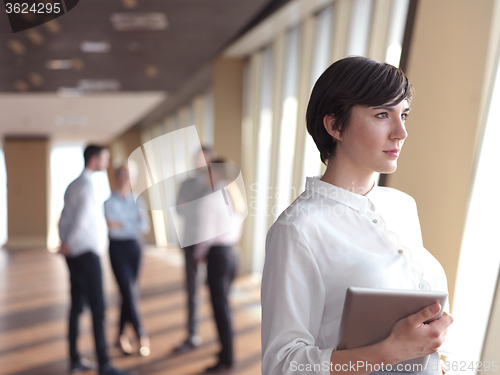 Image of business people group standing together