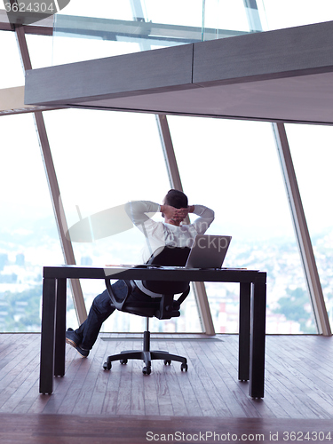 Image of young business man at office