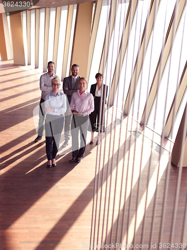 Image of business people group standing together