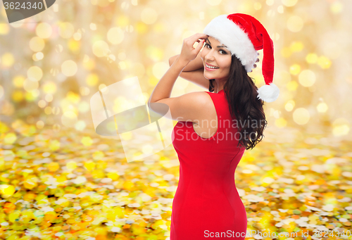 Image of beautiful sexy woman in santa hat and red dress