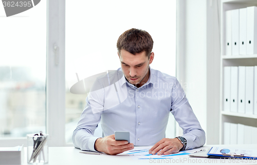 Image of close up of businessman with smartphone