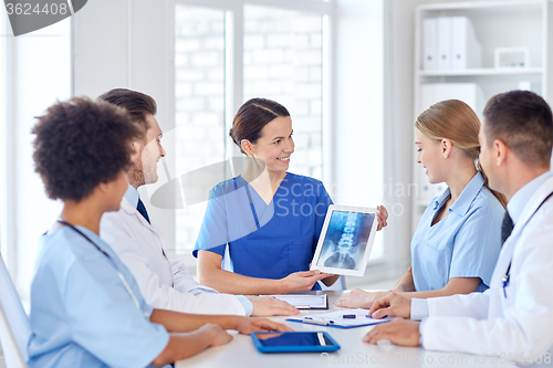 Image of group of happy doctors meeting at hospital office