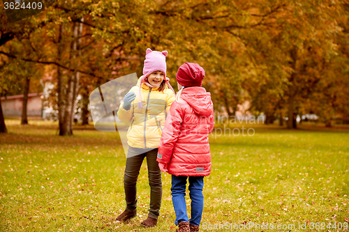 Image of two happy little girls in autumn park