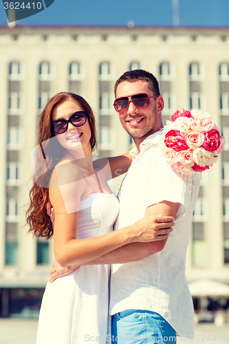 Image of smiling couple in city