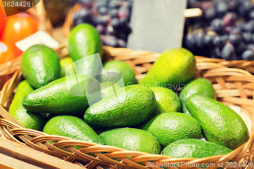 Image of avocado in basket at food market