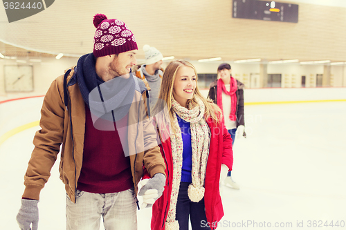 Image of happy friends on skating rink