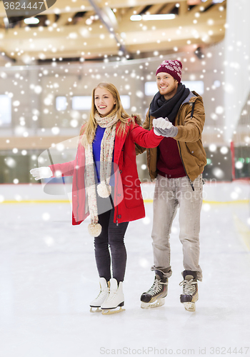 Image of happy couple on skating rink