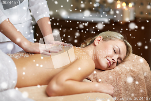 Image of close up of woman lying and having massage in spa