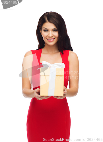 Image of beautiful sexy woman in red dress with gift box