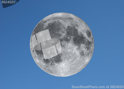 Image of Full moon over blue sky