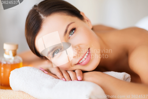 Image of happy woman in spa salon