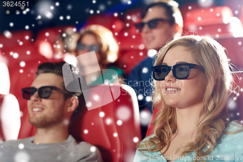 Image of happy friends watching movie in 3d theater