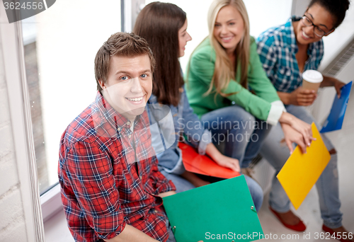 Image of group of happy high school students or classmates